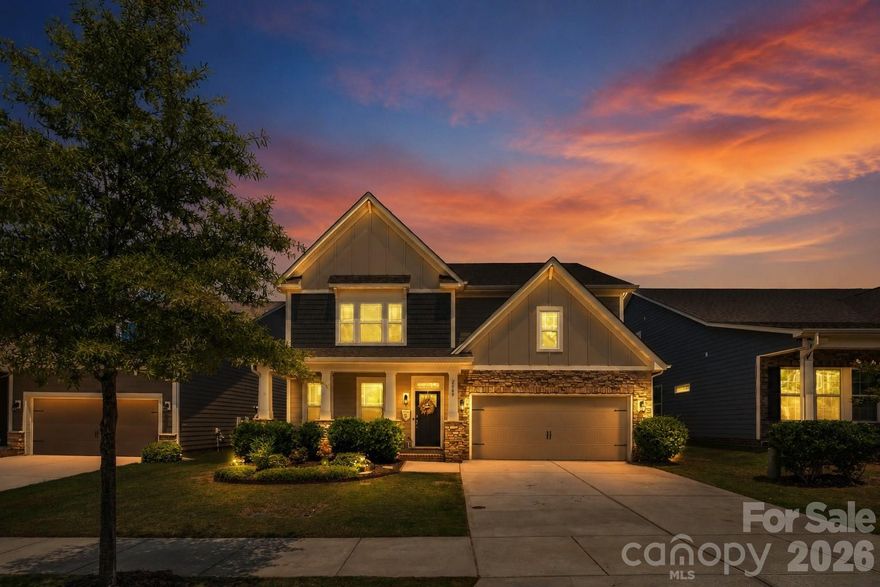 Beautifully maintained one-owner home on a premium wooded lot in a sought-after resort-style community. Built in 2019, this 4BR/3BA home with bonus room offers over 3,200 sq ft of well-designed living space. The kitchen features a large island, double wall ovens, granite countertops, subway tile backsplash, soft-close cabinetry, butler’s pantry, and a custom walk-in pantry, all opening seamlessly to the main living area with gas fireplace and abundant natural light. Upstairs, the spacious primary suite includes tray ceilings, a sitting area with custom built-ins, and a spa-like bath with tile shower, soaking tub, dual vanities, and walk-in closet. A versatile loft provides flexible use, with potential for a fifth bedroom. Additional features include LVP flooring, crown molding, covered porch, extended patio, and added storage. Enjoy community amenities including pools, recreation areas, and more, with convenient access to shopping, dining, and nearby Waxhaw. Assumable loan available—contact agent for details. Lender credit with prefer lender Home Simply.