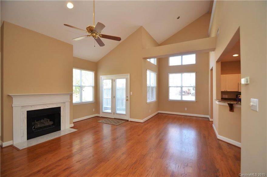 A Beautiful End Unit Townhouse with Master Down in the highly sought after neighborhood of Harborside. This unit has all the upgrades, beautiful Hardwoods, granite counter tops, stainless appliances, new carpet in the master, attached 2 car front load garage and a beautiful private fenced in courtyard. A rocking chair front porch that is perfect for relaxing before you evening walk to the lake or dinner at Port City Club which is just a block away. These units do not last long, do not wait!