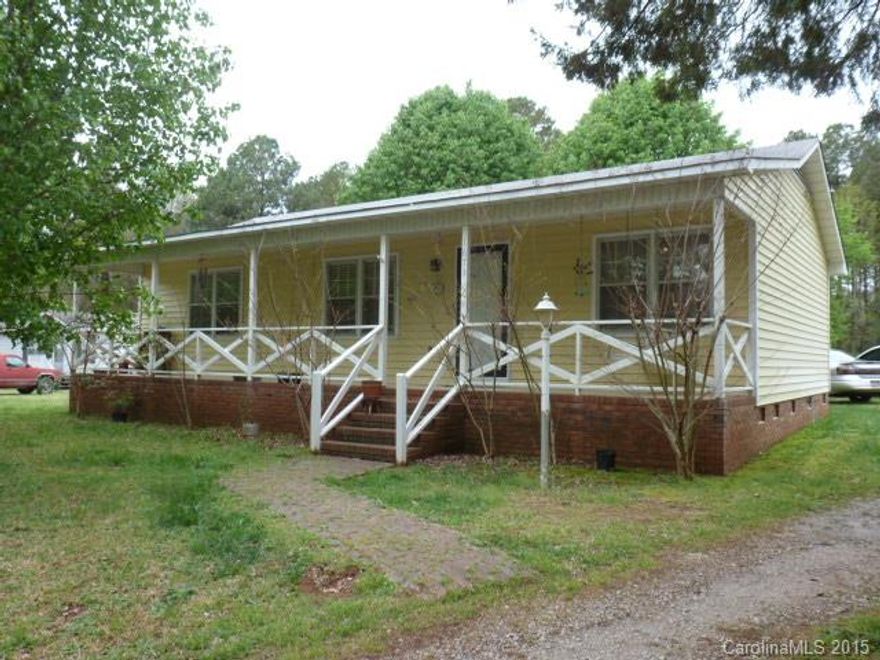Great home with big country front porch, on .96 acre lot.  Home features living room, large kitchen/dining combo with a pantry.  All appliances remain (as is).  3 bedrooms, 2 full baths, back deck, outside storage building.  Easy commute to Monroe, Charlotte, and Rock Hill.
