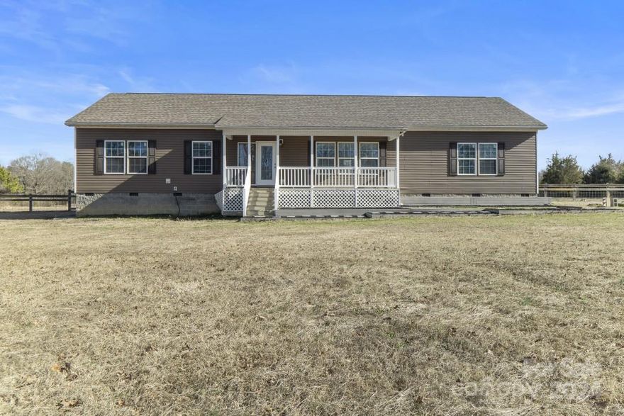 Welcome to your countryside sanctuary! This remarkable property boasts 2 parcels: the charming home nestled on 2.1 acres, accompanied by an additional 6.3-acre parcel of pristine land. This inviting 4-bedroom, 2-bathroom home is impeccably move-in ready. Step inside to discover an interior bathed in natural light streaming through generous windows, accentuating the spaciousness of the living area. The cozy living room beckons for gatherings and relaxation, promising memorable moments with loved ones. The heart of the home lies within the well-appointed kitchen, where modern appliances and ample counter space are perfect for entertaining. Indulge in the luxury of the spacious master bedroom, featuring a sleek, modern walk-in shower, providing a serene escape after a long day.