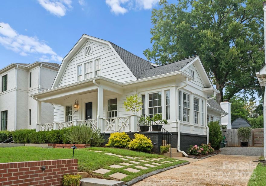 Impeccably renovated 1931 Dutch Colonial steps from Freedom Park & walkable to East Blvd restaurants, Fresh Market, Starbucks, & Atrium Main. This 4BR/3BA gem leaves no detail spared: reimagined by top local designers & craftsmen, the home features renovations by Andrew Roby, design by Greg Perry, custom millwork by Level 5 Finishing Group. Gourmet kitchen features Thermador Professional Gas Range, built-in fridge & beverage fridge, pot filler, custom inset cabinetry—all surrounded by white marble tile. The floor plan flows with sunroom, den, and spacious living room w/ wood-burning fireplace. Spa-like primary bath w/ mosaic marble and frameless shower. The outdoor space is a dream! Enjoy coffee or wine by a stunning fireplace overlooking the lush yard. Cool off in the detached flex lounge w/ concrete floors & freshly painted walls—ideal for office, lounge, or studio. Located on this popular tree-lined street this is truly a special home in one of Charlotte’s most-loved neighborhoods.