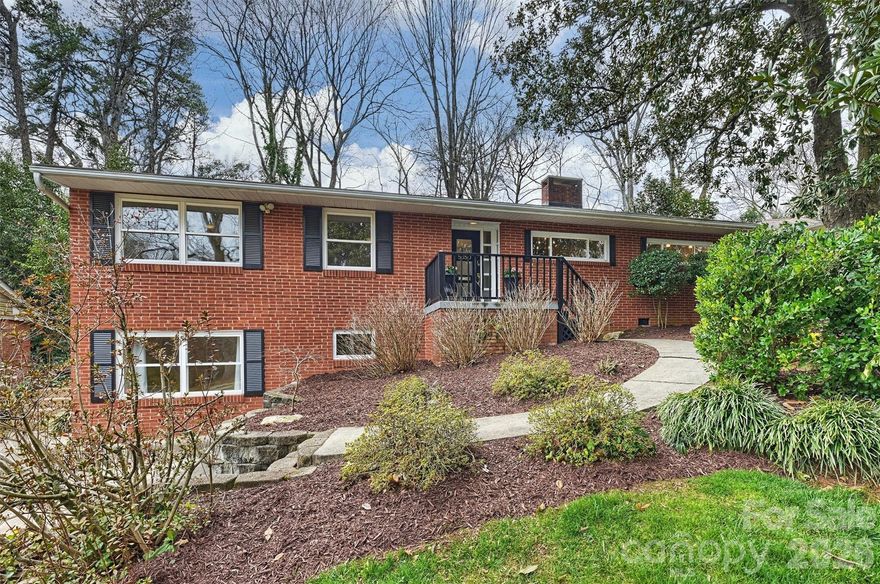 Tucked in the heart of Madison Park, this classic brick ranch with finished basement delivers the space and function you've been looking for! Situated on a mature landscaped lot on a charming sidewalk-lined street, this home offers functional updates, versatile living areas, and both indoor and outdoor spaces to enjoy! Each summer, vibrant hydrangeas surround the front porch, offering a beautiful approach to the home. Inside, the spacious dining area flows seamlessly into the updated kitchen and cozy living room, creating an ideal layout for everyday living. Just off the living room, a light-filled sunroom overlooks the backyard, with direct access to the back patio — perfect for indoor-outdoor living. This home features 4 bedrooms, each with custom closets, and 2 updated bathrooms, including a private en-suite bath in the primary suite. The finished basement provides the ultimate flex space — perfect for a home office, second living area, gym, or playroom — plus ample storage and an unfinished workshop ready for hobbies or future projects. Step outside to a private, expansive backyard featuring a stone patio, ideal for entertaining, and a spacious storage shed to accommodate all your outdoor essentials. Just minutes from the shops and dining at Park Road Shopping Center, SouthPark, LoSo, and SouthEnd, Little Sugar Creek Greenway, CLT airport - it's a prime location!