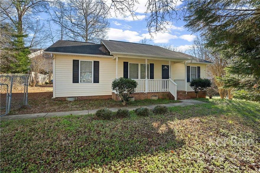 This home sits on a sizable lot and is fully fenced in. The front porch welcomes you into a large living room with vaulted ceilings. Inside is a split bedroom plan, with the dining area attached to the kitchen. The large backyard is overlooked by the home's back deck. This home has so much potential! Parcel is made up of 2 separate pieces of land; .34 acres with home on it and .16 at the corner of Main Street and Herlong Ave. The home is situated close to restaurants, shopping, and medical services, including the hospital. The schools are conveniently close also. Downtown Rock Hill is just minutes away for you to visit a variety of unique restaurants with street festivals and plenty of history.