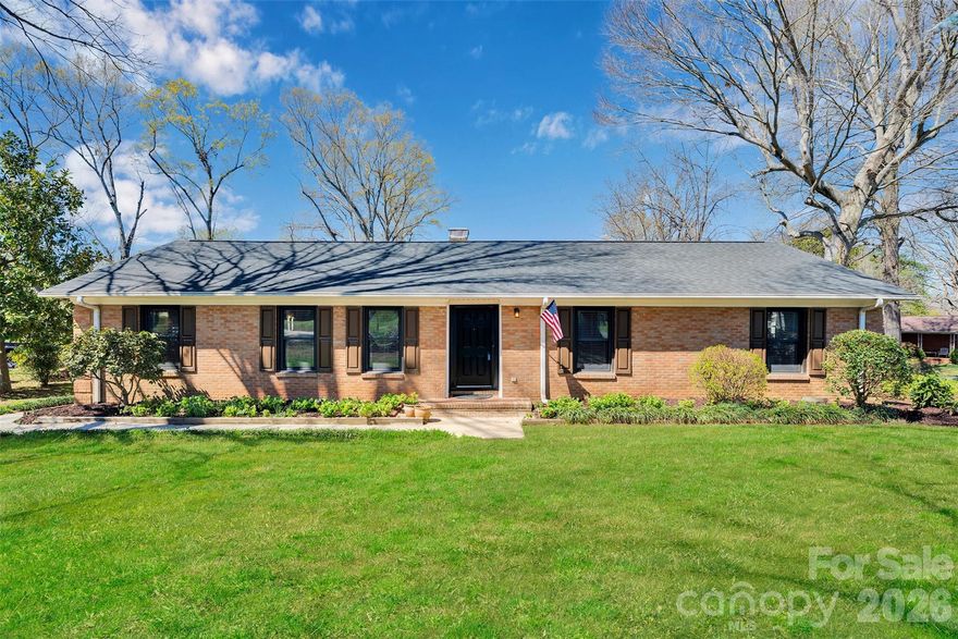 Looking for a ranch home in an established neighborhood with a half acre lot? Stop the car! Full Brick....Complete Kitchen remodel w/ custom Cabinets, granite, Bar stool Island, & subway tile backsplash. Brand New Fridge Included! LVP thru-out most of home & Freshly Painted! Additional features incl soft close drawers & Cab, built-in shelves / desk, board & batten wall accents, upgraded bathrooms, stove fireplace insert, whole house attic fan, Titanium re-enforced Entry Doors, solid wood interior doors, crown molding, & more. The Sun/Bonus Room add-on gives you lots of fun family gathering space.....great for a Rec room. The air compressor, tools, and two freezers in the back section of garage stay with the house! Attic has tons of flooring for storage. Outside, you'll find a sturdy 10 x 12 powered workshop shed, a fenced yard, 3 fig trees, & garden beds. Convenient West Charlotte location......minutes from I-485, 7 min to the airport, & about 20 min to Uptown. No HOA! Seller offering 5K in closing cost credit!