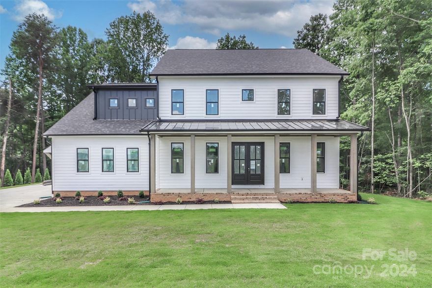 MOVE IN READY...MUST SEE...NEW CONSTRUCTION... PATH TO THE LAKE..Discover serenity, where cherished memories await. Exquisite home sits on 2.6+ acre lot boasting lake access, offering endless opportunities for outdoor enjoyment; canoeing, kayaking, &other water sports that do not require a dock. ROOM FOR POOL! ROOM FOR OUTSIDE KITCHEN! Charming farmhouse, 4 bedrooms, 3 full baths, ample space for comfortable living. The owner's suite epitomizes luxury with spaciousness and expansive walk-in closet that's a dream. Every detail of this home, marks sophistication: granite countertops/stainless steel appliances & contemporary light fixtures/hardware. Thoughtfully designed: family room, dedicated office, kitchen island, and expansive bonus room with half bath.  Interior shines-luxury plank flooring, tiles in baths, recessed lighting, ceiling fans ensuring both style and functionality. Outside, the three-car garage elevates the home's curb appeal, Black windows and accents. Private Patio.