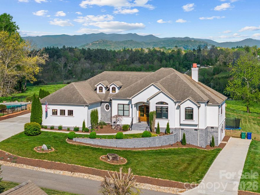 Views That Redefine What Home Means.
Properties like this simply don't come around anymore. Set against a backdrop of sweeping, unobstructed Blue Ridge Mountain vistas, this fully reimagined residence offers something increasingly rare in WNC. It's a premier view lot paired with true luxury finishes, delivered without compromise. 

Built in 2007 and recently transformed with a brand new, top-to-bottom remodel, this beautiful residence blends modern luxury with warm, functional living. The moment you step inside, you’re greeted by a spacious open floor plan that flows seamlessly. Perfect for both lively entertaining and quiet family time.

The chef's kitchen is anchored by a full commercial-grade Sub-Zero and Wolf appliance suite, setting the tone for the caliber of finishes found throughout. Refinished hardwood floors flow through an open, light-filled floor plan designed for effortless entertaining. Every bathroom has been completely upgraded with elevated, spa-inspired finishes. Four bedrooms and three full baths offer the flexibility whether for guests, a private office, or multigenerational living.

But the real heart of the home extends outdoors. The covered porch invites you to live outside as much as inside, taking in those incredible views in any weather. The beautiful backyard is already landscaped and features a garden ready for your homegrown vegetables or flowers. Between the mountain air, the privacy, and the scenery, you’ll find yourself wanting to host every gathering here. In a world where great lots are disappearing, this one remains a rare treasure. And that view, it simply doesn’t exist elsewhere. Come see it for yourself. This isn’t just a house. It’s the view you’ve been dreaming of, finally available for the first time.
