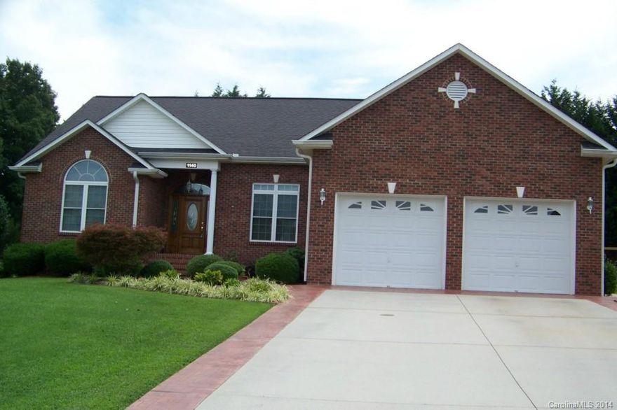 Custom home built in 2001. Home w/all hardwoods, crown molding, throughout the living area & MBR. Cathedral ceiling in Great room & Arch doorway to the dining room. Kitchen w/cabinets galore, pantry, desk area & moveable kitchen island w/additional cabinets. Laundry room w/sink leads to 2 car garage w/pull down attic (tall enough to be finished later if desired). In-ground pool w/ large patio & there is even a full bath outside w/storage area on the back.