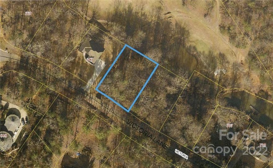Golf course lot with water view on hole #6 of Players Ridge Golf Course. Sloping lot suitable for a home with a basement. Enjoy this lake access community conveniently located minutes from Downtown Hickory.