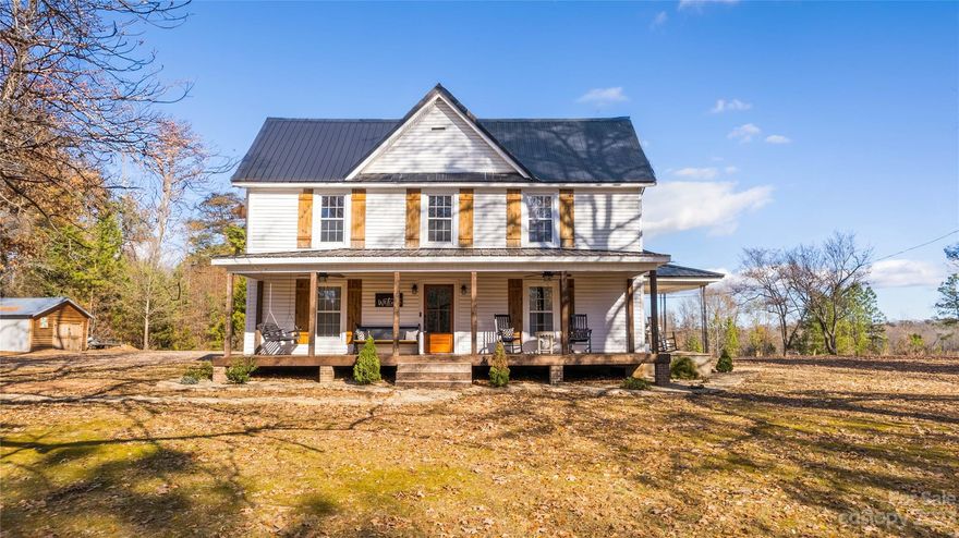 This early 1900s farmhouse has everything, from 2.7 acres of unrestricted land, metal roof, completely updated kitchen, beautiful flooring, renovated bath, storage building, and beadboard ceilings. Thanks to the gas logs, built-ins, and another covered porch - it will be your personal slice of heaven! The kitchen has been updated with a natural gas range, quartz countertops, subway tile backsplash, new cabinets, pendant lighting, and all stainless steel kitchen appliances remain. A massive laundry room, that could honestly serve various purposes for yourself or your family.  The master is on the main level, and there are two bedrooms with a room in between them upstairs that has a closet to service one of the bedrooms.  Located off a long, private driveway, you will feel like you are far away, but have easy access downtown of Landrum! (Hare and The Hound, Stone Soup, antique shopping, and more!) Don’t miss out on this amazing opportunity!