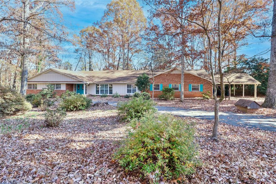 Well-maintained, this spacious one-level home in the Statesville Country Club offers a great floor plan with plenty of room for everyday living. Recent updates include fresh paint, updated bathrooms, plantation shutters, and surround sound. Inside you'll find a formal dining room, large living room, and a cozy den with gas logs and built-in shelving. The eat-in kitchen features a gas cooktop with indoor grill, two wall ovens, and generous counter and cabinet space. The primary suite includes two separate bathrooms—each with its own water heater and heated floors. Three additional bedrooms and a bonus room provide flexible space. The fenced backyard offers privacy and a deck that’s great for relaxing or entertaining. Updates to hvac and crawl space.
