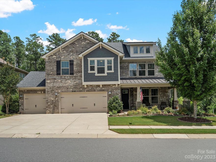 Welcome to this stunning Fort Mill property! The backyard is designed to impress! Heated saltwater pool, in-ground gas-assisted firepit, and an outdoor kitchen with a Big Green Egg. Endless storage solutions in the 4-car garage and custom closet systems in the primary bedroom and kitchen pantry. Custom upgrades include quartz countertops in the kitchen, remodeled fireplace surround, great room shelving, and stylish hood range. Two outdoor cameras and security system. Upstairs, there's an abundance of flex space with a bonus area and loft. The most popular community amenity is a pavilion and boardwalk providing direct access to the scenic Catawba River! The community also offers a pool, disc-golf course, nature trails, recreation area, clubhouse, and more. To top it all off, this prestigious address is zoned for the top-rated Fort Mill Schools. Don't miss out on the opportunity to make this dream home yours today!