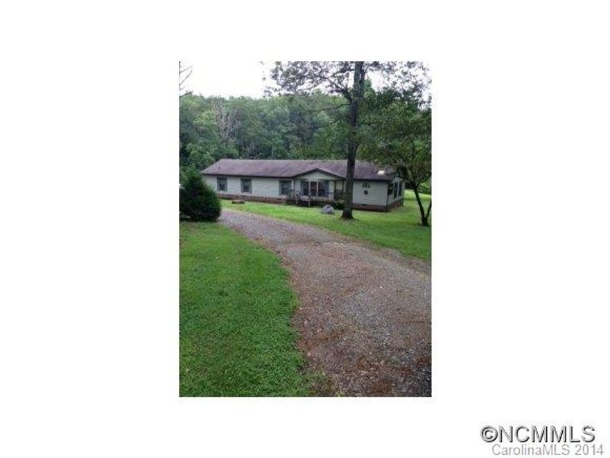 PRIVATE,PEACEFUL SETTING ON 30.23 ACRES. CLOSE TO TRYON EQUESTRIAN RESORT.NICELY LANDSCAPED WITH 2 PONDS AND A BOLD STREAM ON WHEAT CREEK. ADDITIONAL BUILDING SITE WITH SEPTIC TANK.OPEN AND WOODED.THERE IS ALSO A 30' RIGHT OF WAY ON PEA RIDGE ROAD.4 BEDROOM 3 BATH ENERGY EFFICIENT HOME W/ROCK FP IN FAMILY ROOM OPEN TO DECK AND KITCHEN.LARGE MB AND BATH W/GARDEN TUB.JOINING OFFICE. GREAT HORSE FARM POTENTIAL.