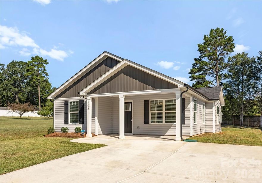 Welcome to 805 East Mills Drive, a home that combines architectural charm with modern comfort. This three-bedroom/two-bath residence offers an open floor plan with a spacious living and dining area, kitchen with granite countertops, stainless steel appliances, and an island perfect for bartop seating. The primary suite features a walk-in closet and en-suite bath with double vanity. Additional highlights include luxury vinyl plank flooring, neutral tones and a combined laundry/mudroom. Outside, enjoy a covered front patio and fresh landscaping. Near Lake Corriher Wilderness Park, this home provides access to trails, kayaking and community events, all minutes from Downtown Kannapolis and the North Carolina Research Campus.

Each office is independently owned and operated. Equal Housing Opportunity.