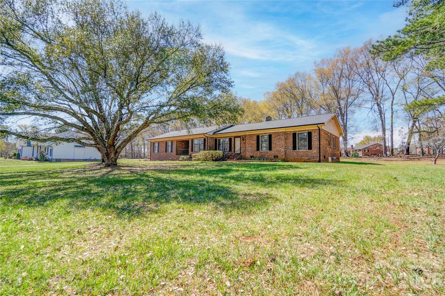 Welcome to this charming Main Street brick ranch home in the heart of Boiling Springs, NC! Offering 3 bedrooms, 2.5 bathrooms, and approximately 2,300 square feet, this home combines classic character with plenty of space to make your own. With several flex spaces, an office area, formal living and family room, the possibilities are endless if space is your priority. Situated on a desirable corner lot spanning nearly 2 acres, the property features a workshop and a flat, spacious backyard, perfect for outdoor entertaining, gardening, or simply enjoying the peaceful surroundings. With its solid brick construction, generous lot, and unbeatable location, this property is full of potential. Sidewalk access leads you right into town, making it easy to enjoy local shops, dining, and community events. A short walk or golf cart ride to Gardner-Webb University! A rare find! Schedule your showing today!
