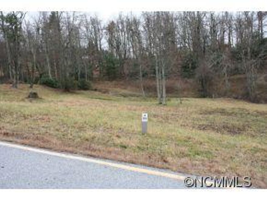 Unique 2ac. Kenmure homesite is located in a low/no traffic cul-de-sac with a small cascading stream and waterfall.4-bedroom septic permit available.  Value priced for larger homesite with easy buildsite. In an area of fine homes. Listing agent on site in clubhouse to assist with showings and to help coordinate builder consultation.