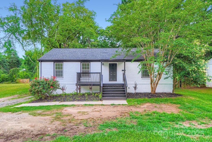 Welcome to Madison Park Living! This updated one-story brick home w/ a finished basement offers the perfect blend of charm & location, just blocks from Park Road Shopping Center. Step inside to find an open living & dining area featuring rich laminate wood flooring & crown molding. The updated kitchen shines w/ crisp white cabinetry & sleek quartz countertops. The spacious primary bedroom is a relaxing retreat w/ an en suite bath that includes a tiled shower, dual vanities, & tile flooring. A secondary bedroom is tucked away for privacy & restful nights, w/ an updated full bath nearby. Downstairs, the finished basement expands your living space with a large recreation room, kitchenette, full bath w/ tiled shower, and a generous third bedroom—ideal for guests, extended family, or a home office setup. Enjoy the outdoors from the covered back patio overlooking a backyard, ready for your landscaping dreams. Extras include replacement windows, new HVAC system, & a storage building.