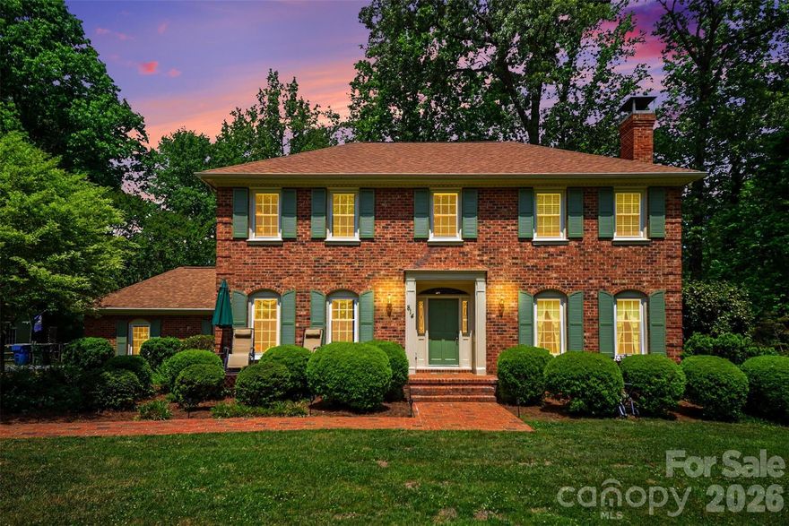 Tucked back on 2.23 acres, 814 S Main St is the kind of place that just feels different the moment you pull in. You’ve got space, privacy, and a setting that almost makes you forget you’re not in the mountains, yet you’re only 5 minutes to downtown Mount Holly, under 10 to Belmont, and about 10 minutes to the Whitewater Center, with easy access to major highways.

It’s quiet, it’s private, and it gives you room to breathe...something that’s getting harder to find this close to everything. The all-brick exterior gives the home a solid, timeless feel, and it carries that same comfortable, classic vibe throughout.

The screened-in porch is perfect for slow mornings or winding down in the evening. Just off of it, the sunroom brings in great natural light and can be whatever you need it to be, a workout space, sitting room, office, or creative spot. Out back, you’ve got a real backyard, plenty of space, a firepit area for nights with friends, and room to enjoy without feeling on top of your neighbors.

It’s one of those properties that hits both sides, you’re close to everything you need, but when you’re home, it feels like your own little escape.