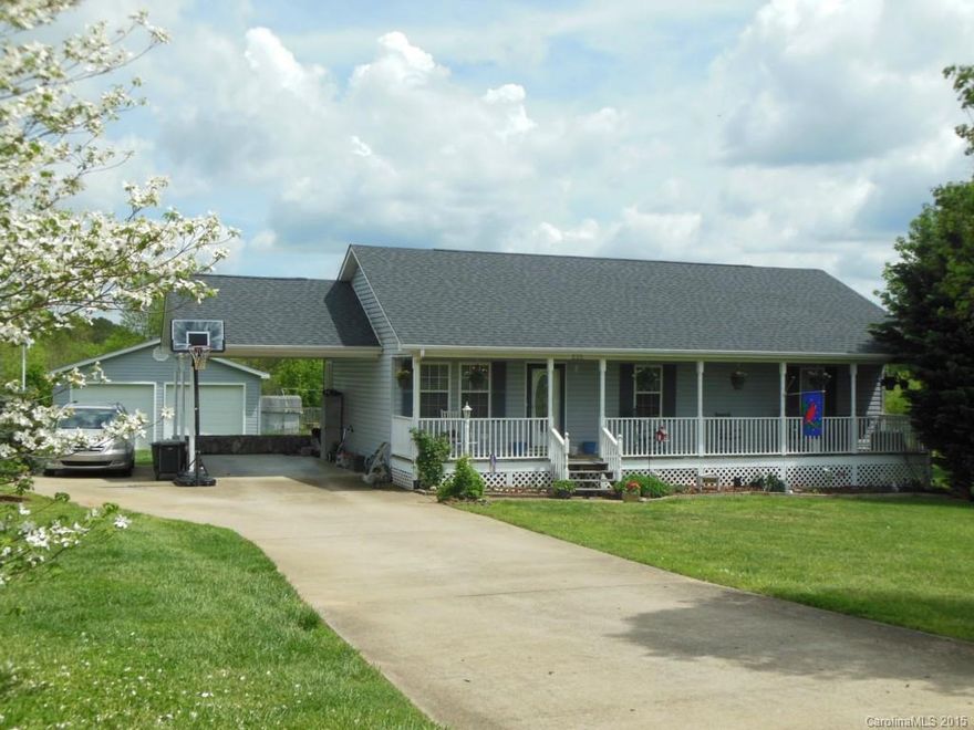 Cherryville gem in Terrace Estates!  This home features a huge 2 car wired garage on a level lot; plus a 2 car attached!  This 3 bedroom, 2 bath ranch with open floor plan and beautiful bamboo flooring awaits. Full of natural light, the spacious living area is open to the eating area & kitchen. Gorgeous designer vanity in second full bathroom. Additional outside access to the carport & also the deck. Over 1/2 an acre to spread out & enjoy the great back yard! Don't miss this!!