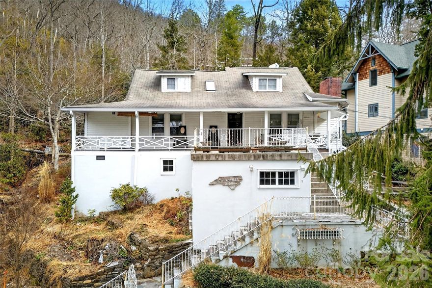Step back in time with this enchanting 1911 Montreat home, ready to be brought back to its original glory. Rich in character and set in one of Western North Carolina’s most beloved communities, this 4-bedroom, 4.5-bath residence offers timeless appeal just 5 minutes from downtown Black Mountain.

Wood floors throughout, a welcoming covered front porch, and classic architectural details reflect the craftsmanship of a bygone era. Outdoors, stone patios, terraced gardens, and a charming gazebo create a serene setting ideal for relaxing or entertaining, all bordered by a gentle creek that enhances the property’s peaceful ambiance.

A detached garage adds convenience, while the setting in beautiful Montreat offers a rare opportunity to restore and personalize a historic home surrounded by natural beauty, trails, and a strong sense of community. This is a truly special property for those who appreciate history, charm, and potential.
