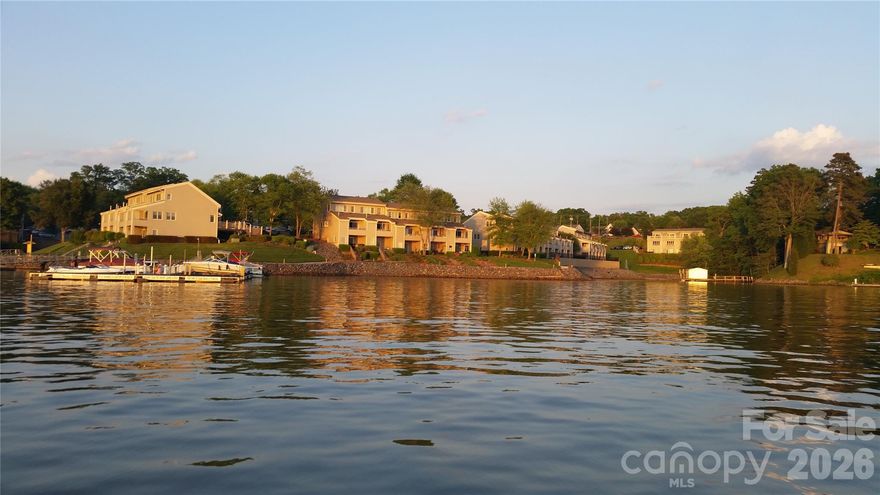 Lake living with all the perks that come with it! Seasonal views of Lake Wylie from this rare end-unit townhome perfectly situated in the heart of it all! The Yachtsman on Lake Wylie is one of the lake's most underrated waterfront communities! This highly sought-after end unit is one of only a few in the community offering extra windows that flood the space with natural light. Featuring 3 bedrooms, 3 full bathrooms, and a convenient half bath on the main level, this home offers plenty of space for living and entertaining. Updates include replaced windows and a full home water filtration system. The sellers used this as lake getaway a few times a year. Barely lived in, this home is turnkey ready for a new lake lifestyle owner! Gated community amenities include a private sand beach, tennis courts, clubhouse, pool, ponds and fountains, sidewalks, boat storage area, and marina access. Boat slips may be leased through the HOA for just $1000 per year (subject to availability). The HOA covers exterior maintenance, amenities, and trash service — leaving only utilities (gas, electric, cable, and water/sewer) for the homeowner to handle. $10,000 price improvement!
