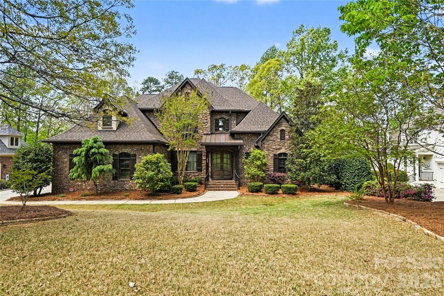 On an elevated position along a scenic, rolling golf course in South Carolina’s sought-after Springfield community, this beautifully crafted residence by award-winning Arthur Rutenberg Homes (AR Homes) offers an exceptional blend of elegance, comfort, and timeless design.

This 4-bedroom, 3.5-bath home showcases thoughtful architectural details, refined finishes, and a seamless open flow designed for both everyday living and elevated entertaining. The chef’s kitchen is a standout feature, equipped for both function and style, and opens to light-filled living spaces where expansive windows frame picturesque golf course views.

The primary suite is a true retreat, featuring a custom coffered ceiling and a beautifully appointed bath with an oversized tub and walk-in shower showcasing exceptional craftsmanship. Upstairs, the billiard room offers an ideal gathering space, complete with a wet bar and elevated views of the yard and golf course, along with two additional bonus rooms offering flexibility for a variety of uses.

The inviting lanai provides the perfect setting for morning coffee or evening relaxation, overlooking the course with a front-row seat to golfers navigating the 3rd hole sand trap. The vaulted office on the first floor features expansive windows, offering a welcoming view of the azalea-filled backyard.

Community amenities in Springfield are exceptional. The clubhouse features three pools, a fitness center, picnic area and a playground, with new lighted tennis and pickleball courts currently under construction. The neighborhood also offers an 18-hole public golf course with driving range, multiple pocket parks and playgrounds, and annual general admission access to Anne Springs Greenway.

Known for its welcoming atmosphere and strong sense of community, the Springfield neighborhood offers a tranquil retreat while remaining conveniently located within 30 minutes of downtown Charlotte, minutes from I-77, and just 20 minutes from the airport. This home is a rare opportunity to experience luxury living with scenic beauty, convenience, and a warm, welcoming community all in one.