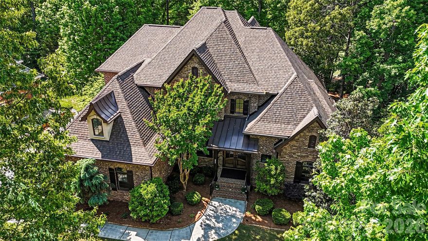 On an elevated position along a scenic, rolling golf course in South Carolina’s sought-after Springfield community, this beautifully crafted residence by award-winning Arthur Rutenberg Homes (AR Homes) offers an exceptional blend of elegance, comfort, and timeless design.

This 4-bedroom, 3.5-bath home showcases thoughtful architectural details, refined finishes, and a seamless open flow designed for both everyday living and elevated entertaining. The chef’s kitchen is a standout feature, equipped for both function and style, and opens to light-filled living spaces where expansive windows frame picturesque golf course views.

The primary suite is a true retreat, featuring a custom coffered ceiling and a beautifully appointed bath with an oversized tub and walk-in shower showcasing exceptional craftsmanship. Upstairs, the billiard room offers an ideal gathering space, complete with a wet bar and elevated views of the yard and golf course, along with two additional bonus rooms offering flexibility for a variety of uses.

The inviting lanai provides the perfect setting for morning coffee or evening relaxation, overlooking the course with a front-row seat to golfers navigating the 3rd hole sand trap. The vaulted office on the first floor features expansive windows, offering a welcoming view of the azalea-filled backyard.

Community amenities in Springfield are exceptional. The clubhouse features three pools, a fitness center, picnic area and a playground, with new lighted tennis and pickleball courts currently under construction. The neighborhood also offers an 18-hole public golf course with driving range, multiple pocket parks and playgrounds, and annual general admission access to Anne Springs Greenway.

Known for its welcoming atmosphere and strong sense of community, the Springfield neighborhood offers a tranquil retreat while remaining conveniently located within 30 minutes of downtown Charlotte, minutes from I-77, and just 20 minutes from the airport. This home is a rare opportunity to experience luxury living with scenic beauty, convenience, and a warm, welcoming community all in one.