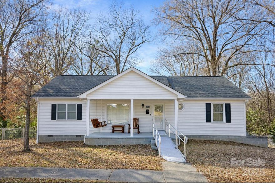 UPDATE 3/12/26 - **$8,000 SELLER CONCESSION + NEW FLOORING WITH ACCEPTABLE OFFER.  Rock solid home in a desirable Concord location featuring thoughtful additions, and strong indoor-outdoor living. The home offers a spacious primary suite addition with high tray ceilings, a large closet and a well-appointed bath featuring custom tile, double vanity, walk-in glass shower, soaking tub, and private toilet room. Relax on the front porch, sunroom, or handsome back deck! Unfinished walk out basement provides excellent storage and future potential. Outdoor features include a custom deck with fire pit table, spacious fenced yard, mature trees, and wooded privacy. Less than 2 miles from Downtown Concord's shopping and dining. Just 1 mile from Les Myers Park, easy access to walking on Union St. *Seller to arrange and pay for installation of new carpet and LVP with acceptable offer plus $8,000 seller concession at closing with acceptable offer. Don't miss your opportunity to call this home!