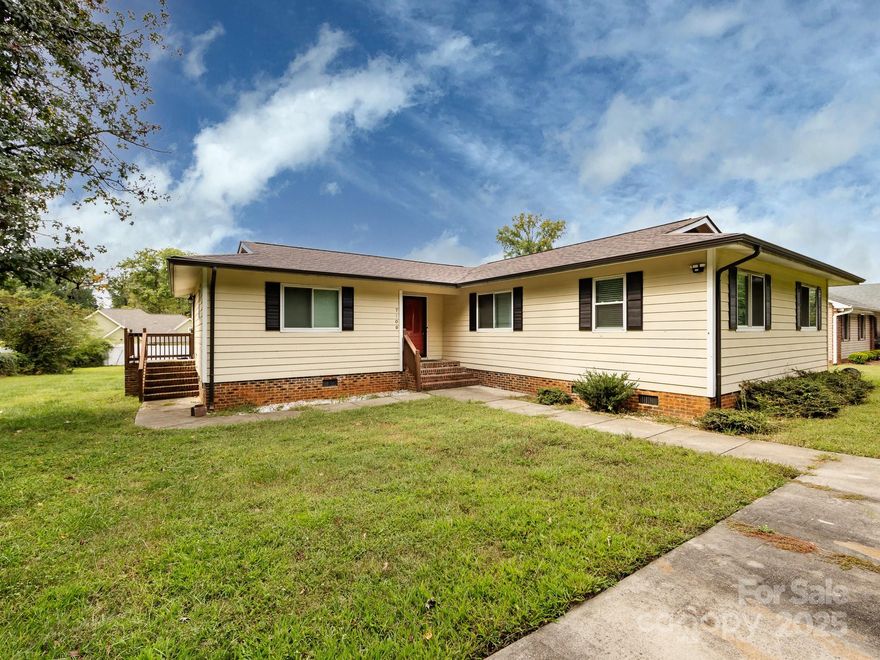 Back on the market, no fault of the seller. Looking for a no HOA community w/ a BIG level backyard w/ a 2 tier deck measuring 24 x14 ft. on the upper/main deck & approx. 9 x 7.5 on the lower deck for great entertaining. There is a 12 x 10 ft. storage building that is wired w/ electrical. Inside the home has a  great room(approx. 19 x15 ft.) & dining area(16 x 11ft.) w/ laminate wood flooring. Updated kitchen has large tile floor, island w/ built-in wine cooler, large subway tile back splash, and pass through opening to the dining area w/ a ledge to add barstools if desired. Kitchen includes refrigerator but also has space for a freezer or 2nd refrigerator. The primary suite(16.5 x 13.5 ft.) has laminate wood floors, walk-in closet, w/ tile floor in primary bathroom. The other 3 bedrooms and hall had laminate flooring as well. Guest bathroom has linen closet, tile surround in the shower & tile flooring. Community is about 7.5 miles from downtown, about 3.8 miles from UNC-Charlotte, & conveniently located minutes away from shopping, dining, & highway access. Even though the current home schools are favorable seller said that there is also an option to enroll your child in governors village stem academy(which is what they did).