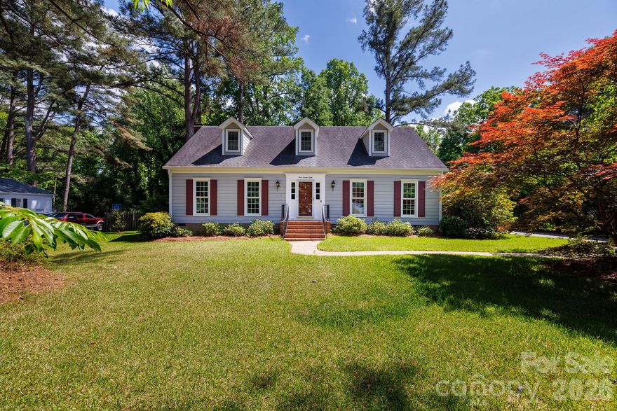 Welcome to your private retreat in the heart of the established Heathwood subdivision. Nestled on a generous 0.65-acre lot, this home offers classic charm and outdoor serenity, featuring mature landscaping with two signature bay trees and direct access to a peaceful creek in the backyard. Inside, the warmth of Appalachian hardwood floors leads you through a thoughtful layout, including a cozy den anchored by a gas fireplace and custom built-ins. The eat-in kitchen has a gas line already in place for those who prefer a gas range. Hosting is effortless with a formal dining room and the added convenience of a bedroom on the main level. The primary suite serves as a true escape with dual closets for ample storage. Step outside to the impressive two-tier deck, perfect for entertaining within the security of a fully fenced backyard. With updated electrical, a 2-10 home warranty included, and extra storage available in both the attached area and the detached building, this home is as practical as it is beautiful.