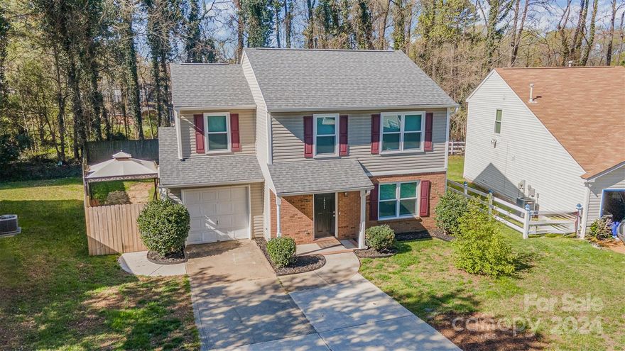 Newly Remodeled 5-Bed, 3-Full Bath, 2-Story House w/ Bedroom/Bonus Room on the Main Floor, NO HOA! This cute, cozy home has the following new features: Fresh Paint throughout, New Windows(2024), New Roof(2022), New Dishwasher(2023), New Hot Water Tank (2024), New LVP Floors and Carpet(both 2023). The garage has been converted into a bedroom/bonus room w/ sink, countertops, cabinets and refrigerator and a secondary entrance for a private suite. The quiant kitchen complete w/ freshly painted cabinets, added pantry cabinetry and laundry room overlooks the spacious fully fenced-in backyard.  Added Pet door and seperate enclosure so your fur-baby can enjoy the outdoors. The 2nd Floor is complete w/ the Primary Bedroom and 3 additional Guest Bedrooms. This home is located conveniently to UNC Charlotte, IKEA, Top Golf, The Light Rail, 10min from Uptown and Near I-85. Don't pass up this opportunity to make this your home! BACK ON MARKET, buyer cancellation ahead of inspections and appraisal.