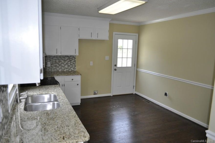 Incredible level of finish that you may not expect in comparably priced homes. New kitchen granite, new stove,new stainless steel dishwasher, new deck, new doors & hardware, new 12mm wood laminate flooring, new carpet, new lighting, two remodeled bathrooms with new fixtures. Fresh paint, Nothing was overlooked in remodeling of this gorgeous home in a very desirable area. Based on price, condition and past sales, this home will not be on the market long. Don't wait!