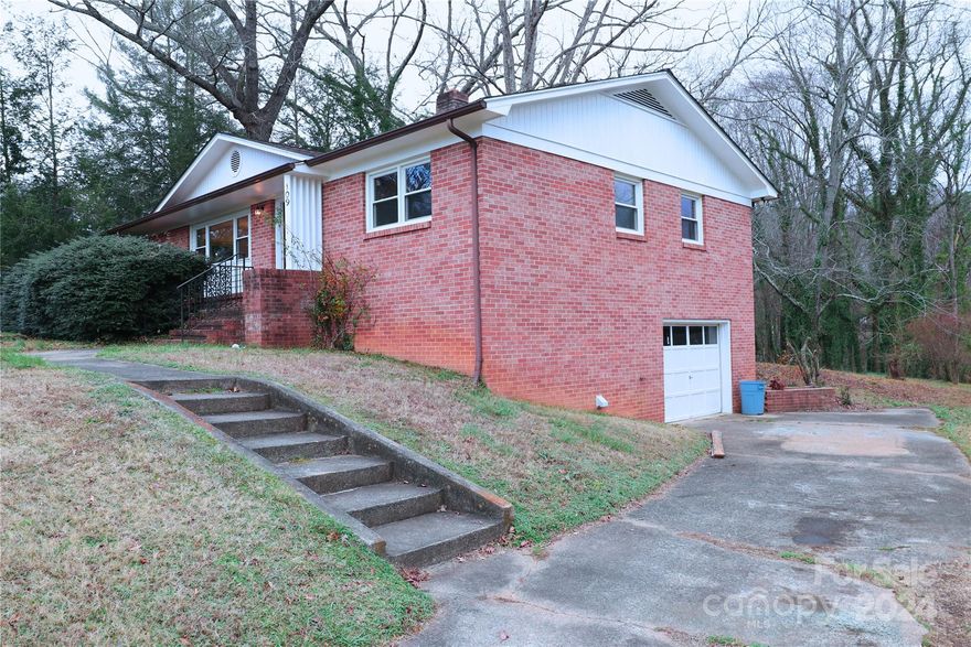 Lovely full-brick home in a fantastic location, directly across from Catawba Meadows Park!  This charming three-bedroom, one-bathroom features a basement and attached garage.  Enjoy the convenience of being just moments away from local shops and amenities while living in a peaceful, scenic neighborhood.  A wonderful opportunity to own a home in this sought-after area!