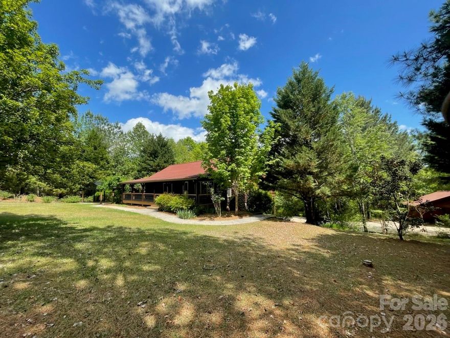 Tucked away on 2.78 acres, sits this quiet, spacious, custom log cabin beauty.  A relaxing front porch invites you into this 3 bedroom, 3 bath (+a multi-purpose room), kitchen with upgraded granite countertops, AC Heat Pump replaced in 2020 and now offering NEW ROOFs  w/ GUTTERS (11/2025) with outstanding warranties.  The expansive screened in back porch invites you to a peaceful oasis with access to your very own creek.  Basement features it's own private family/living room, large bedroom, full bath, kitchenette and it's own private driveway, offering you a wonderful opportunity for a guest house, multi-generational living, studio or game room or even a gym.  3 driveways, 3 carports, tractor shed.  Large chicken coup or possible green house already in place.  Abundant outdoor living spaces for everyone to enjoy, and plenty of room for RV's, campers, and the toys. Come take a look at this private hidden gem because these pictures don't do it justice.  Located in Clearwater Creek, not your typical gated community, offering trails, common areas, creeks, wildlife and plenty of privacy while still being close to everything you need!