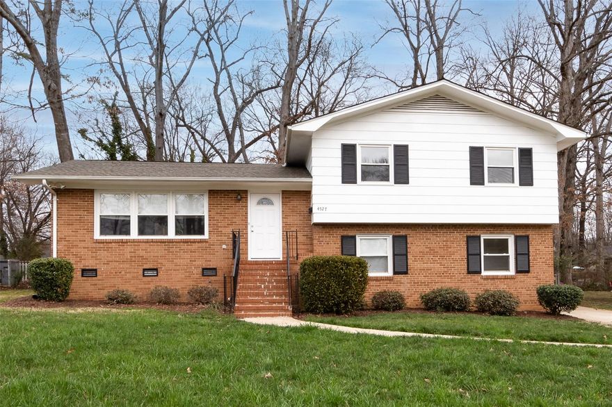 Updated tri-level home w/ large fenced in backyard. On main level home has a huge living room next to formal dining w/ crown molding. Kitchen has granite countertops, stainless steel appliances & tile backsplash. There is an overhang bar countertop for barstools. Downstairs has a spacious family room(den) w/ can lighting. The lower level also has a 4th bedroom w/ walk-in closet, half bathroom, & office(small bonus room) with a side door entrance. The primary & BR's 2 & 3 are upstairs.  The primary suite has 2 closets & it's own full bath w/ tile shower. 
Updated windows & refinished wood floors through most of the home. Gas furnace was replaced about 3 years ago. Duke Energy replaced the electrical panel in 2022. Home has smooth ceilings throughout. Community is conveniently located to Hwy 85, shopping, places to eat, and approximately 5 miles from downtown Charlotte & UNCC.