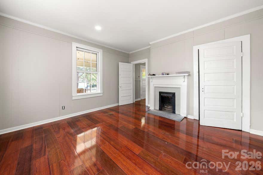 No HOA! This Bungalow style home has been partially renovated, including a new roof and updated interior! Fresh paint, new LVP wood flooring, and new tile in bath & laundry/mudroom. New kitchen counters and cabinets, and all appliances convey. Home has all new plumbing & new electrical wiring and is wired for HVAC (but no unit is installed). Charming 2-way fireplace between Primary bedroom & Living Room. This .77 acre property also has a very large workshop that was originally used as a mechanics auto workshop, as well as a garage structure; seller cleared a lot of trees. Being sold AS IS. Any personal property inside or outside of the home at the time of showing will remain and will not be removed by seller. 224 Bush St. is convenient to Ferguson Park, shopping, dining and downtown Gastonia, as well as easy access to I-85 and 321. Buyer / Buyer agent should verify all information based on intended use.