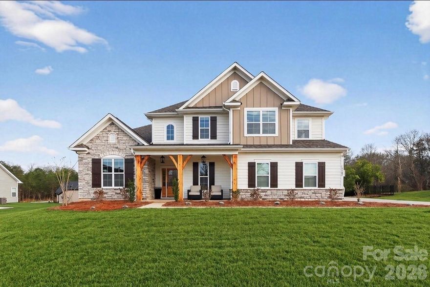 Enjoy the feel of new construction in this beautifully maintained one-year-old Craftsman-style home set on a .60-acre homesite backing to mature trees, offering a private setting and peaceful views from the covered rear porch. A soaring two-story foyer welcomes you and leads to the dining room with a dramatic 12 ft ceiling and arched entry. The open kitchen features quartz countertops, a large island, soft-close cabinetry, and stainless-steel appliances, flowing seamlessly into the family room with a gas fireplace and built-in cabinetry. The main-level Premier Suite includes a tray ceiling, walk-in closet, and spa-like bath with soaking tub and tiled shower. A guest bedroom on the main level provides flexibility for guests, a home office or multi-generational living. Upstairs offers a loft with built-in desks, a spacious recreation room, and additional bedrooms, including one with a private bath. The current owners have completed several thoughtful enhancements, including landscaping with sod and plantings, a fenced backyard, irrigation system, and window treatments throughout, adding to the home’s move-in-ready convenience.