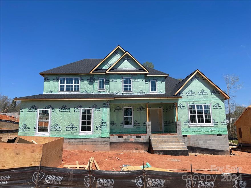 Craftsman-style home features Primary and guest suites on the first floor with gorgeous finishes in an open gourmet kitchen. Kitchen has white stacked cabinets to the ceiling, under-cab lights, GE SS app w/ Monogram 36" 6 burner rangetop, extraction hood, Profile wall oven/micro, quartz counters & backsplash, plus large walk-in pantry. Butlers pantry has lower cabinets. Dramatic 2-story entry hall. Arched entry flanked by columns lead you to the formal dining with 13' high ceilings. Primary suite offers huge double walk-in closets; bath has free-standing tub & large tiled shower. Family rm w/ gas fireplace & 16' sliders open to a covered porch. This home has a 3 car sideload garage space and offers a large rec room, loft area and 3 nice sized secondary bedrooms. Large walk-in attic storage. 6" oak hardwoods in most of main floor and upstairs loft/hall. Stairs have oak treads & iron balusters. The Enclave at Massey has a superb community amenity package plus sought-after schools.