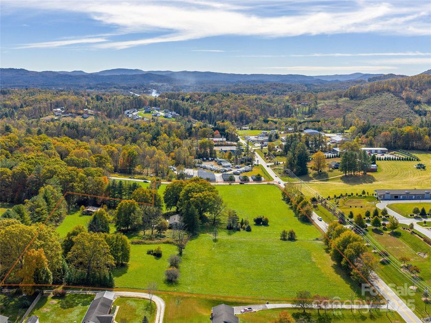 Introducing an exceptional development opportunity in the heart of Mills River. This MRMU-zoned property offers a strategic foothold for land or industrial investors seeking a presence in the thriving Asheville market.

Situated at the intersection of Old Fanning Bridge Road and NC Highway 191, the parcel enjoys nearly 900 feet of frontage on NC 191 with excellent visibility and accessibility. The rectangular configuration, public water access, and gentle topography create a highly developable site suitable for a range of uses. A septic system will be required, but site conditions support straightforward infrastructure planning.

With its premier location and versatile development potential, 5620 Old Haywood Road stands out as a compelling investment in one of Western North Carolina’s most desirable commercial corridors.

Existing house and barn conveyed at no value.


- located at corner of NC 191 and Old Fanning Bridge Rd.
- nearly 900 feet of frontage on NC 191 
- access to public water (12" and 6" lines)
- gentle topography
- Town of Mills River 
- Mixed Use zoning