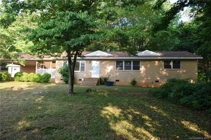 Looking for acreage and privacy? This even has a pond. Home is quite dated and will need some TLC. But with some work this could be a private oasis. Property will require a cash buyer or rehab loan only. Great location very easy access to Charlotte and surrounding areas.  Could easily be a 3 bedroom house as it has a den with a closet but it does have a 2 bed septic system. Estate Property. No NC Property Disclosure. Subject to Court Approval. To be sold as is.