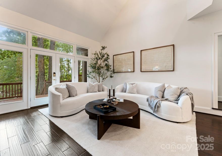 Tucked just outside the vibrant city of Charlotte, this privately wooded escape offers the perfect blend of serenity & convenience.  Step inside & you'll be immediately greeted by the stunning 2-story great room filled with natural light pouring through the expansive windows & framing breathtaking views of popular Lake Norman. Every detail of this home has been tastefully updated to create your personal sanctuary.  Freshly panted interiors, designer light fixtures & a chef-inspired kitchen with top-of-the-line features bring both elegance & functionality to daily living.  With stunning lake views from every room, this retreat is truly a nature lover's dream! Imagine starting your mornings with tranquil water vistas & ending your evening with sunsets over the lake. Outside, enjoy your own private doc with boat lift-ideal for weekends on the water or perfect for entertainment. Home offers a FINISHED BASEMENT equipped with a movie theater, workshop and endless entertainment opportunities!  Whether you're seeking a full-time waterfront residence or weekend retreat, this home has something for everyone. Welcome to the lakefront lifestyle you've been dreaming of!