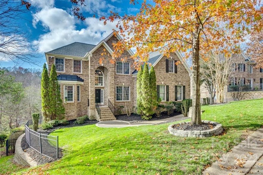 Waterfront home of YOUR dreams in Tega Cay Community! This 6 bedroom 4.5 full bathrooms, loft, plus finished basement home is 5300 sq ft of living space plus lots of storage space. The very spacious floor plan offers an office, dining room, great room with fireplace, white cabinets, stainless steel appliances, gas stove and beautiful staircase leading up to the loft and secondary bedrooms. Main Floor Owner's suite has high ceilings and large on suite with a garden tub, stand-alone shower, dual sinks and walk in closet. Upstairs there is a large loft area and four generously sized bedrooms with 2 full bathrooms (one full bathroom is a jack and jill). The finished basement features a bedroom, full bath, fireplace, and spacious open floor plan that can be turned into a second living quarters, home workout gym, recreation area, family room, playroom or whatever suits your needs. Head out to the patio and walk down to the lake and check out the floating dock/boat lift! BRING US AN OFFER!