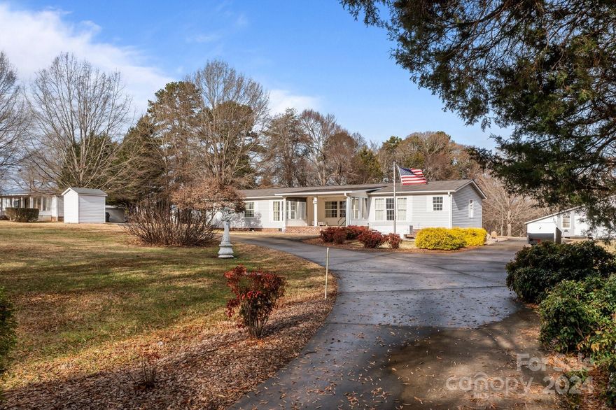 Welcome to this beautiful property at 1540 E Ridge Road, offering a perfect blend of peaceful country living & convenient access to nearby amenities. Situated on 2.46 acres of lush, open land, this home is an ideal for those seeking space, privacy, and functionality. A large, versatile pole barn provides ample storage space for vehicles, equipment, or can be transformed into a workshop, hobby space, or studio. This property also offers a large building great for additional storage use. The home features 3BR-3BA with a welcoming living space & abundant natural light, showcasing a comfortable floor plan ideal for everyday living. The kitchen is equipped w/ ample cabinetry and spacious countertops & a large center island! The three bedrooms are generously sized, offering plenty of room for rest & relaxation. This property offers the best of both worlds: a peaceful, rural setting with easy access to nearby towns, shopping, schools, and medical. Don't miss the chance to call this home!