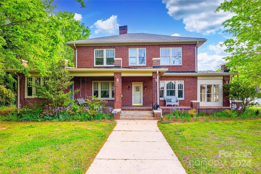 Step into history in Monroe's expanded historic district! This charming home welcomes you with its timeless character. Full brick exterior, real wood flooring and fresh paint throughout. One of the highlights is the terrazzo floor sunroom, with tons of natural light. This home offers ample closet storage with cedar closets in all bedrooms. The large, covered front porch and enclosed side porch are perfect for relaxing. The home has detailed trimwork, light fixtures, and all furniture can convey with the home at the buyer's request. Detached full-brick workshop has power connection and can be converted to a garage. Monroe's historic district features a diverse range of architectural styles, including Victorian, Queen Anne, Craftsman, and more. Located approx. 30 minutes from Charlotte and less than 5 min to the Historic Monroe Social District, this home offers the ambiance of a historic neighborhood with easy access to modern amenities like dining, retail and community parks and trails.