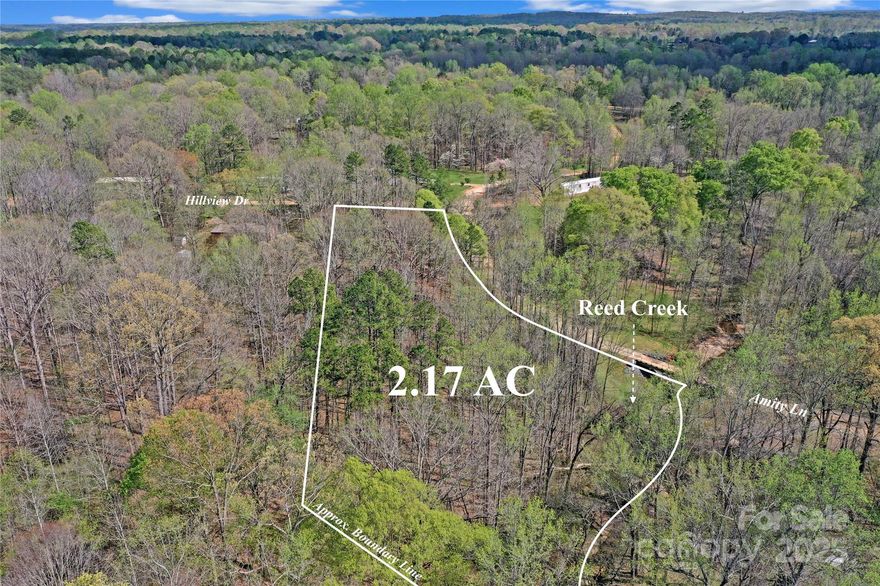 2.5 Acres with a homesite for sale, on the corner of Amity Lane and Hillview Dr. The property is bordered on one side by a year-round water source, a scenic waterway known as Reed Creek. This property has good topography for a homesite at the top of the hill with a slope extending through mature hardwood trees to the creek below. The property is located on a privately maintained road, and is 20 minutes from Lake Norman and 20 minutes from nearby Lincolnton NC. The corners have been identified and flagged and a perk test is in progress. Check it out today!