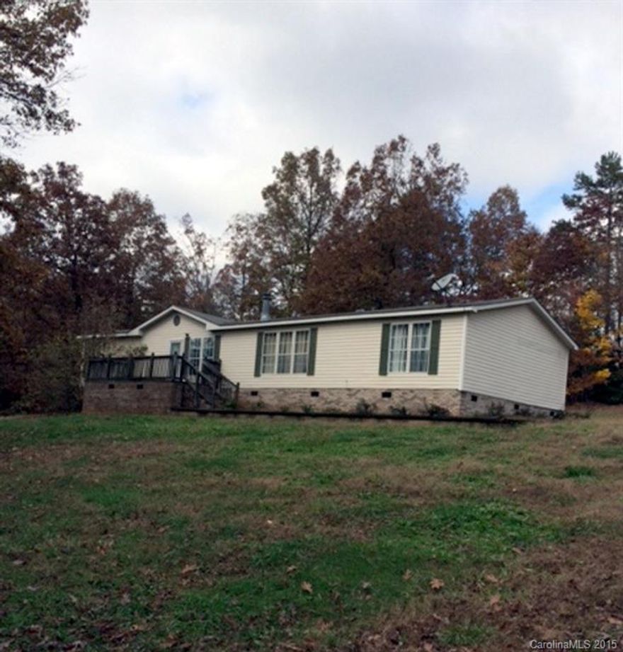 Nestled on two lots this spacious doublewide offers 3 bedrooms, 2 baths plus an office. Large family room & kitchen are all open. Front deck & enclosed screen porch on the back. Priced to sell! Appliances stay!