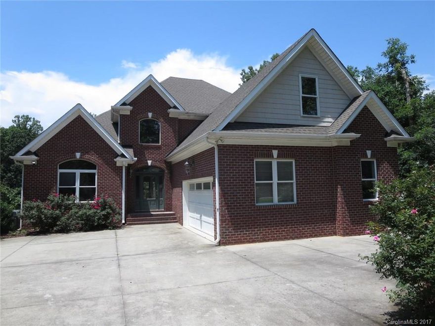 Waterfrontage Home with Pool, Pier, Deck, and Lakeside entertainment area.  Huge Owners Retreat with Sitting Room, Dual Walk-In Closets and soaking tub.  Two-Story Great Room with soaring ceilings lets in tons of natural light and home offers plenty of space for entertaining.