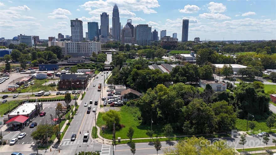 Premier OPPORTUNITY ZONE transit-oriented development site positioned just three blocks from Uptown Charlotte and steps from both the 9th Street and Parkwood CityLYNX Gold Line stations, with walkable access to the LYNX Blue Line. This 0.47-acre ML-2 zoned assemblage at 1113, 1125, and 1127 North Tryon Street offers outstanding visibility, a full signalized intersection, and very strong traffic counts, creating exceptional access and exposure for a future mixed-use, multifamily, office, medical, or retail project. The property sits within the City’s North Tryon Vision Plan, a 60-acre public-private revitalization initiative driving walkability and urban placemaking, and is surrounded by transformative investments, including the $600M Seventh & Tryon redevelopment that will deliver a new central library, office tower, retail, and civic plaza. Only eleven blocks from Bank of America’s headquarters and Uptown’s core employment, cultural, and entertainment districts, this site provides developers and investors a rare opportunity to deliver a signature project at the leading edge of Charlotte’s North Tryon corridor.