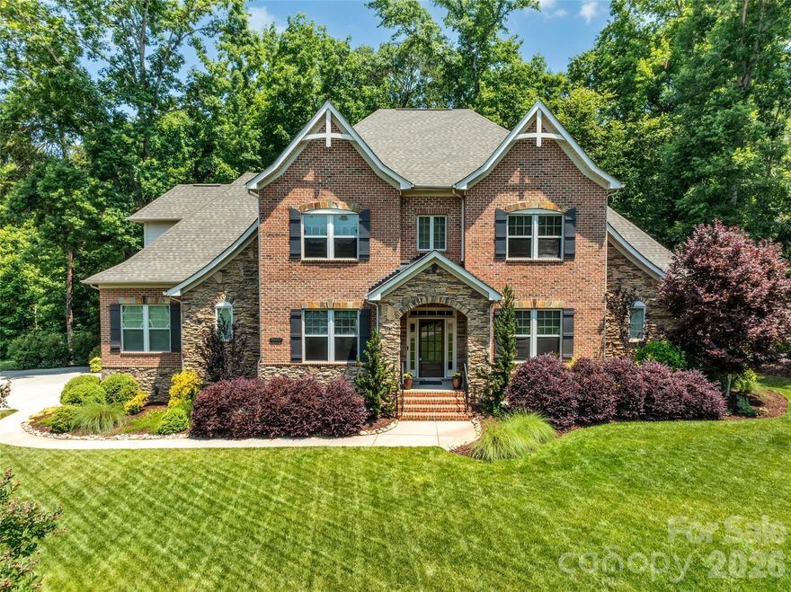 Welcome to the exclusive, private gated community of Farrington. This luxury home is well maintained and perfectly situated near Ballantyne, Pineville, and Fort Mill. Set on a corner lot, the mature wooded landscaping offers complete privacy. The open-concept design effortlessly blends the living room and kitchen, creating an ideal space for entertaining. The expansive kitchen features a central island, custom cabinetry, a gas cooktop, walk-in pantry, SS appliances, and a charming butler's pantry. The primary BR on the main level is a true retreat, boasting a luxurious en-suite bathroom, a spacious walk-in closet, and direct access to the large screened-in porch. Upstairs, you'll find three additional BR, two having en-suites, along with a full hall BA. The large bonus room, complete with a gas FP, offers endless possibilities, while an extra versatile room at the end of the hall is ideal for a bedroom or more. Brand new paver patio, back yard landscaping and stone pathway to a fire pit.  Schedule your viewing today and begin envisioning your dream home!