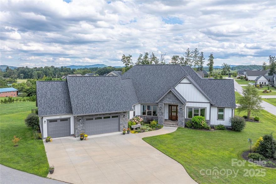 Elegant Single-Level Living in Mills River Crossing-Discover refined  comfort in this spacious 3-bedroom, 2.5-bath home located on a serene cul-de-sac in the prized gated community of Mills River Crossing. 
This single-level residence is designed for effortless living with 12-foot ceilings and tons of light in the living area and primary suite, creating a spacious, airy feel throughout.  
The home boasts high end finishes, an office just inside the front door, dual closets and a spa-like bathroom in the primary suite.  The great room features built in cabinetry flanking a soaring limestone gas fireplace.  
The gourmet kitchen offers Kitchen-aid appliances, abundant cabinetry, pot filler and a large walk in pantry.  The kitchen flows seamlessly into the open-concept living spaces, while a screened porch with a built-in gas grill and fireplace invites year-round entertaining.  Enjoy a generous 3-car garage, large laundry room, ample storage, lush landscaping, partially fenced backyard, breathtaking year-round views and  unforgettable sunrises.  Generous storage in the encapsulated walk-in basement, dual HVACs, on demand hot water, Nest thermostats and Ring doorbell and cameras complete the bespoke lifestyle this home offers. 
Community amenities include a playground, pavilion, and walking path, perfectly complimenting easy luxury living with a welcoming neighborhood feel