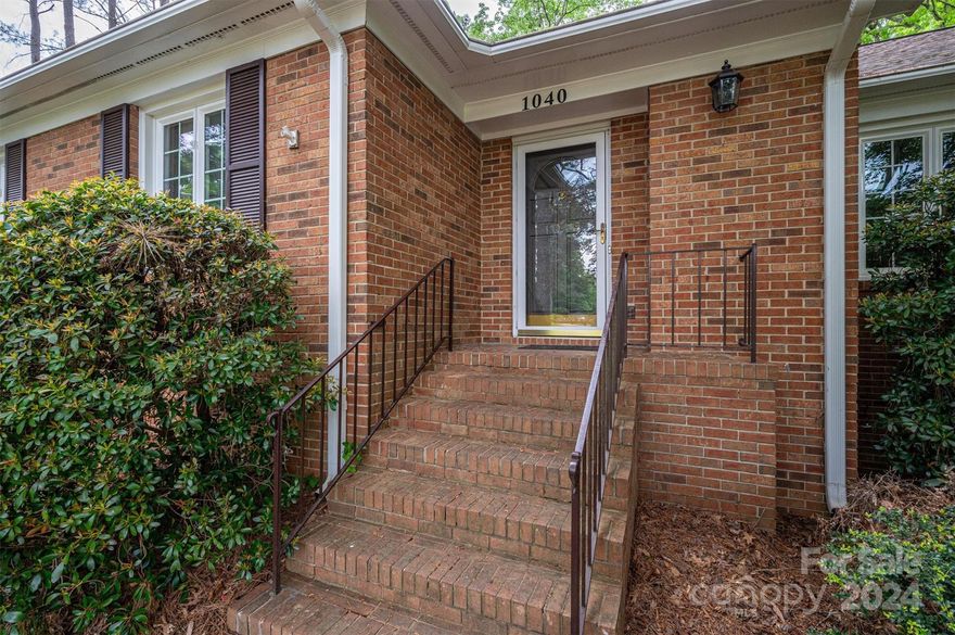 Nestled in Gastonia's serene Shannon community, this charming house offers tranquility and privacy amidst landscaped yards and mature trees. With two expansive decks, outdoor relaxation is a breeze. Inside, discover four bedrooms and two full baths on the main level, while the finished basement boasts a second living space with its own kitchen. Meticulously maintained with modern updates throughout, the centerpiece is the main-level living room featuring rustic wooden beams, a cozy gas fireplace, and extensive built-ins. Enjoy meals in the updated eat-in kitchen or the adjacent full dining room, complete with a convenient homework desk. This home truly epitomizes comfort and functionality, making it an ideal retreat for families or individuals seeking both convenience and charm in Gastonia's coveted Shannon neighborhood.